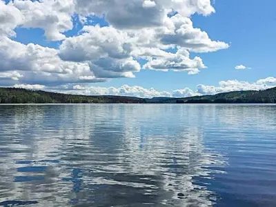 a large body of water with clouds in the sky at 4 star holiday home in Fall-By Traum in Raufoss