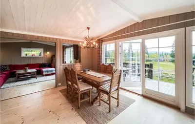 a dining room with a table and chairs at Beautiful Home In Sjusjøen With Kitchen in Sjusjøen