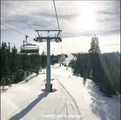 a ski lift on a snow covered ski slope at Hafjell Alpinlandsby Apt 88 in Hafjell