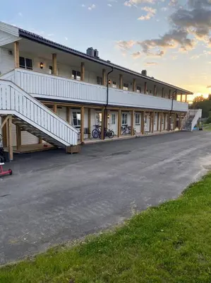a large building with bikes parked in front of it at Charming apartment in Meråker in Meråker