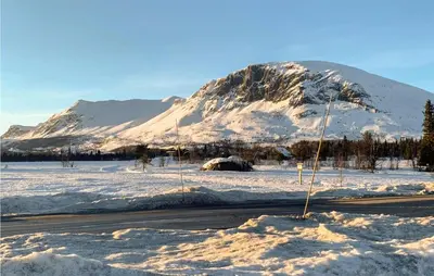 a snow covered mountain in front of a road at 3 Bedroom Lovely Home In Hemsedal in Hemsedal