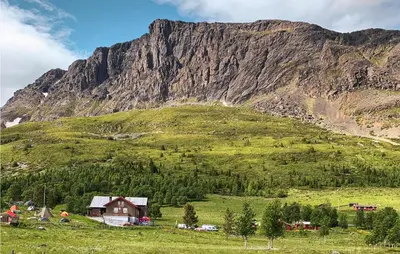a house in a field in front of a mountain at 3 Bedroom Lovely Home In Hemsedal in Hemsedal