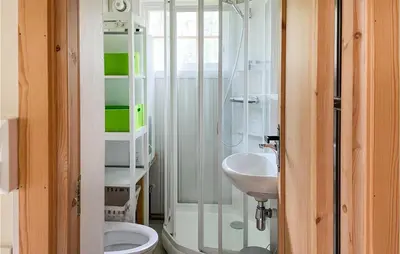 a bathroom with a shower and a toilet and a sink at Lovely Home In Eggedal With Wifi in Eggedal