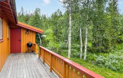 a porch of a house with a view of the woods at Lovely Home In Eggedal With Wifi in Eggedal