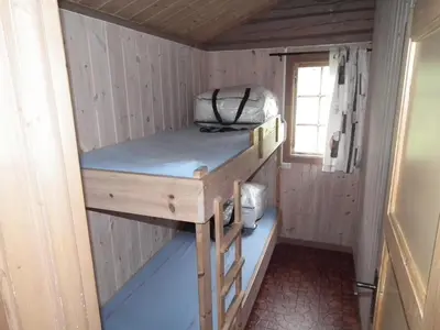 a room with a bunk bed in a tiny house at Smegarden Camping in Oppdal
