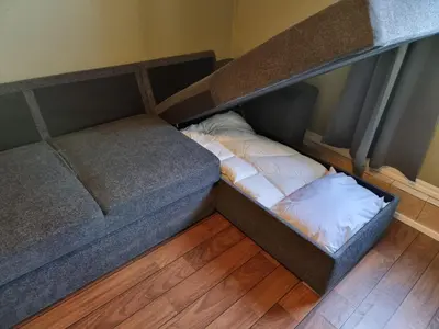 an overhead view of a bed in a room at Kjellerleilighet egen inngang. in Stange