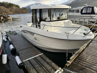 a white boat is docked at a dock at 6 person holiday home in AVERØY-By Traum in Stein