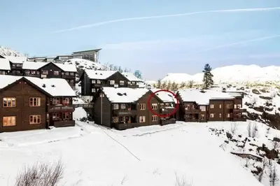 a group of buildings in the snow at Skarsnuten Fjellandsby 23, Hemsedal, Ski-in/out in Hemsedal