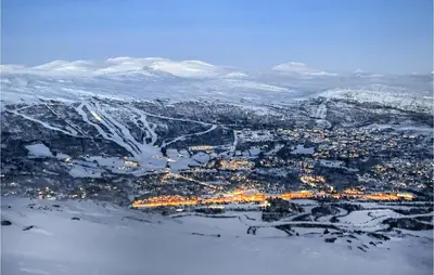 an aerial view of a city with snow covered mountains at Beautiful Home In Bjorli in Bjorli