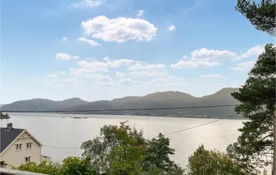 a view of a lake from a house at 2 Bedroom Stunning Home In Foldfjorden in Skogli