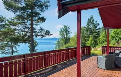 a deck with a view of the water at 2 Bedroom Stunning Home In Foldfjorden in Skogli