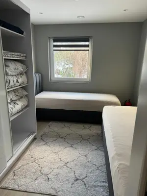 a bedroom with a window and a bed and a window seat at Eksluzywny apartament w zaciszu in Kristiansund