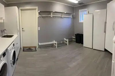 a laundry room with a washer and dryer at Villa i Isfjorden! in Isfjorden