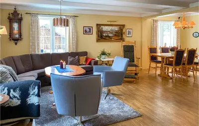 a living room with a couch and a table at Stunning Home In Verma With Kitchen in Bjorli