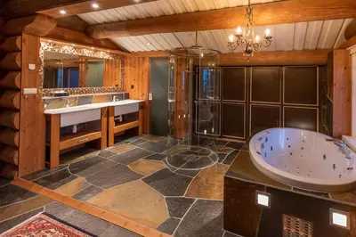 a large bathroom with a tub and a sink at Chalet De Luxe 518 in Trysil