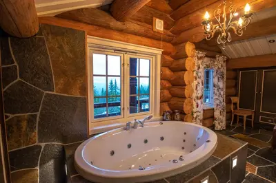 a large bathroom with a tub and a window at Chalet De Luxe 518 in Trysil