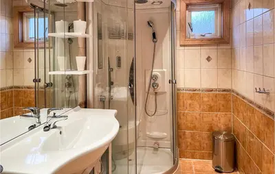 a bathroom with a sink and a shower at Cozy Home In Østby With Wifi in Trysil
