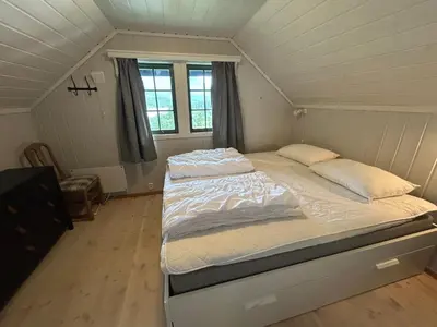a bedroom with a large bed in a attic at Cabin with a great view at Gaustablikk in Gaustablikk