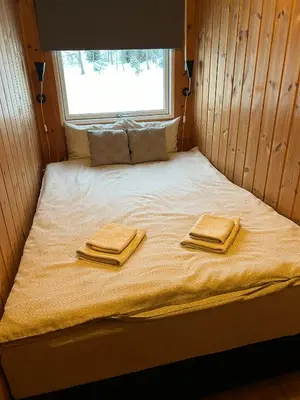 a bed in a room with two towels on it at Apartment Grønlid in Rauland