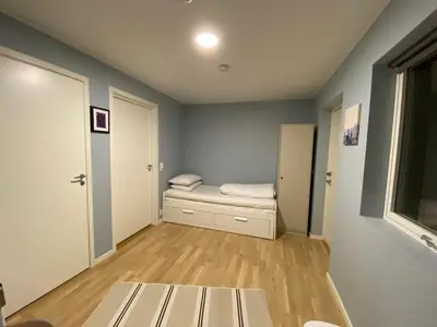 a small room with a bed and a window at Your Dream Studio in Bergen in Bergen