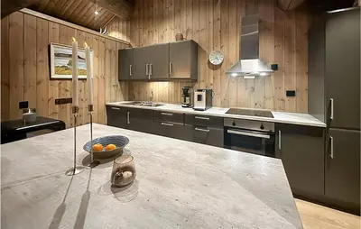 a kitchen with a counter with a bowl of oranges on it at Awesome Home In Hornindal With Wifi in Hornindal