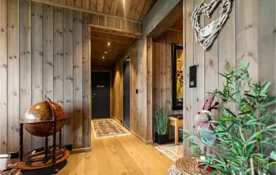 a hallway with wooden walls and wooden flooring at Awesome Home In Hornindal With Wifi in Hornindal