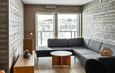 a living room with a couch and a table at Lovely Apartment In Geilo With Wi-Fi in Geilo