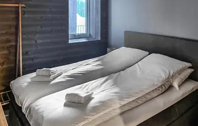 a bed with two towels on it in a room at Lovely Apartment In Geilo With Wi-Fi in Geilo