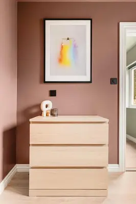 a dresser in a room with a picture on the wall at Odda Living - 3BR & 1BR - A3 in Tokheim