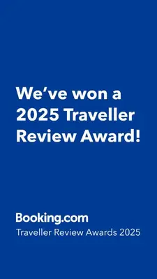 a blue sign that says weve won a traveler review award at Cozy and warm just like at home, Free P, Big terrace in Langevåg