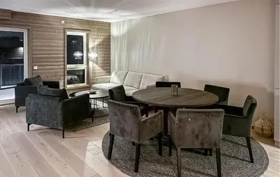a living room with a table and chairs at 2 Bedroom Stunning Apartment In Geilo in Geilo