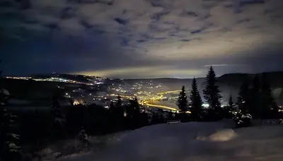 a view of a city lit up at night at Øyer Fjellstugu in Øyer