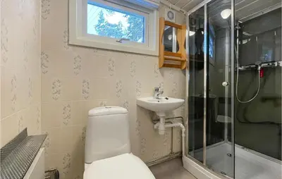 a bathroom with a toilet and a sink and a shower at Awesome Home In Trysil With Wifi in Trysil