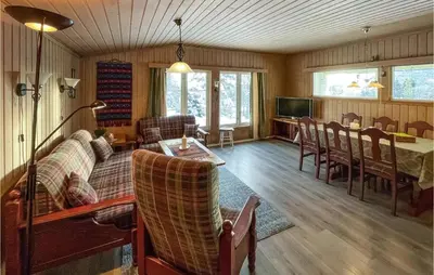 a living room with a couch and a table at Awesome Home In Trysil With Wifi in Trysil