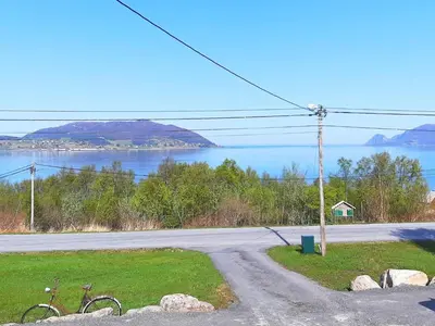 an empty road with a view of a lake at 6 person holiday home in Åram-By Traum in Sandvik