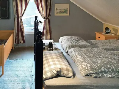 a bedroom with two beds and a window at 6 person holiday home in Åram-By Traum in Sandvik