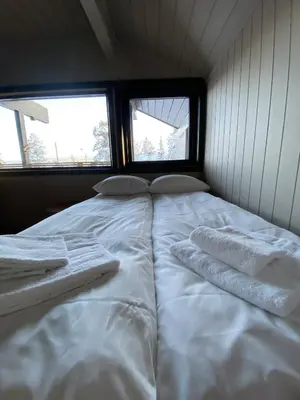 a bed in a room with two towels on it at Newly renovated apartment with a central location in Geilo