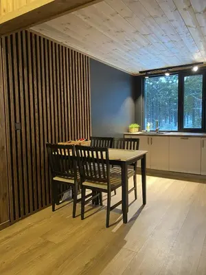 a dining room with a table and two chairs at Newly renovated apartment with a central location in Geilo