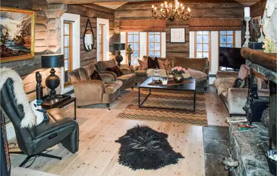 a living room with a couch and a table at Awesome Home In Hemsedal With Sauna in Hemsedal