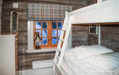 a bedroom with a bed and a window at Awesome Home In Hemsedal With Sauna in Hemsedal
