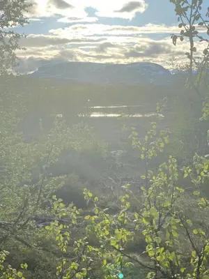 a view of a valley with a body of water at Bjørnebuhytten, Geilo, 13 sengeplasser med privat Jacuzzi og el-bil-lading in Geilo