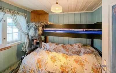 a bedroom with a bunk bed in a room at 4 Bedroom Nice Home In Vang I Valdres in Vang I Valdres