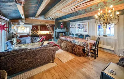 a living room with a bed and a couch at 4 Bedroom Nice Home In Vang I Valdres in Vang I Valdres