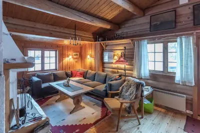 a living room with a couch and a table at Trysilfjellet sør 318 in Trysil