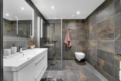 a bathroom with a sink and a toilet and a shower at New Nice apartment Trysil alpine lodge with the lift right outside in Trysil