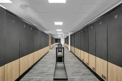 a hallway with rows of lockers in a locker room at New Nice apartment Trysil alpine lodge with the lift right outside in Trysil