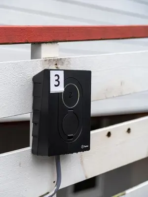a black outlet on a bench with the number three at Trolltunga Hostel in Tysso