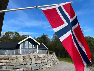 a flag in front of a house at Villa Blue Dream in Kristiansund