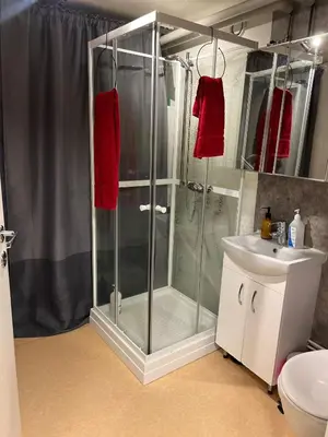 a bathroom with a shower and a sink at Trondheim, Kroppanmarka Tiller in Trondheim