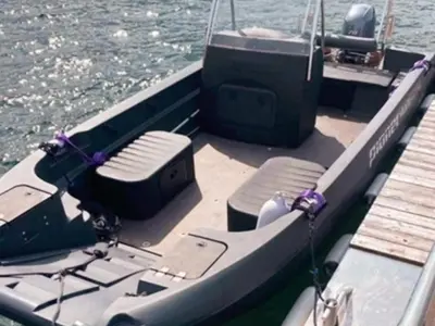 a boat with seats and a dock in the water at 6 person holiday home in Gursken-By Traum in Larsnes